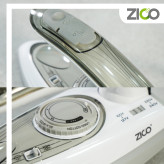 اتو ZC-2055 در کنار چمدان کوچک در حال بستهبندی